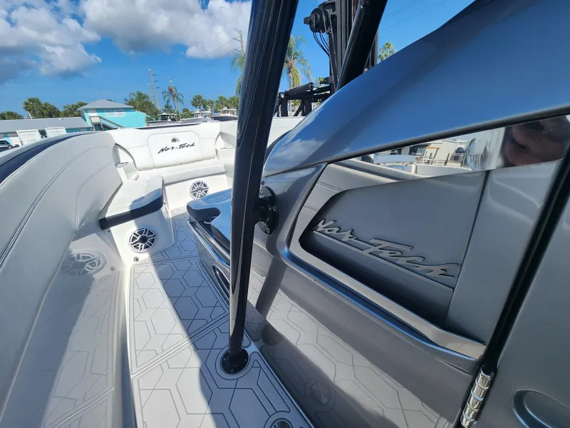 Slide: The Image of 2023 Nor-Tech 340 Sport Center Console boat interior with sleek design and modern features. - 14