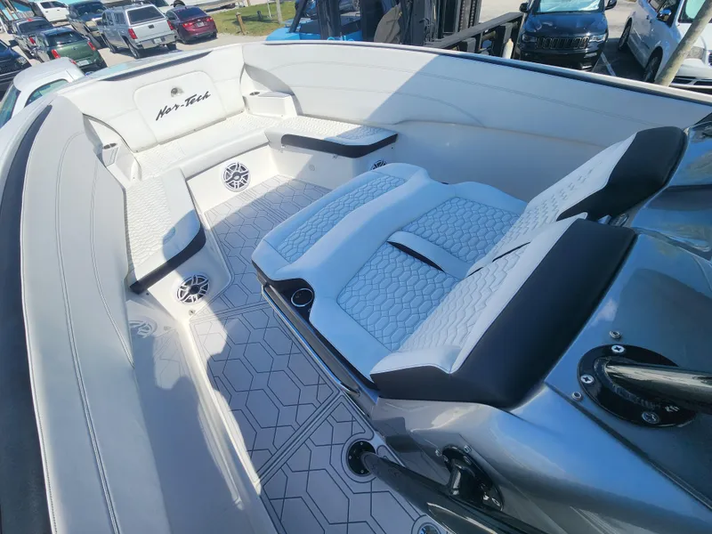 Slide: The Image of 2023 Nor-Tech 340 Sport Center Console boat interior with stylish seating and modern design. - 15