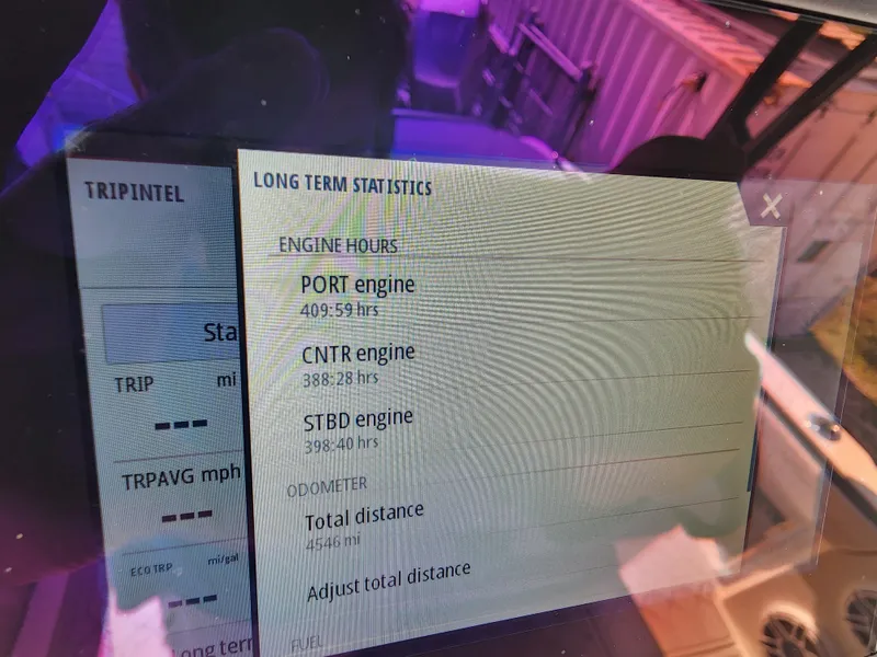 Slide: The Image of Display showing engine hours and statistics on a 2023 Nor-Tech 340 Sport Center Console. - 21