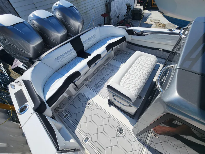 Slide: The Image of 2023 Nor-Tech 340 Sport Center Console with triple Mercury engines and luxurious seating. - 7