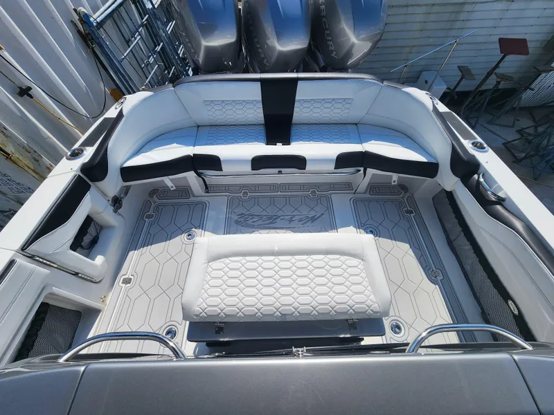 Slide: The Image of 2023 Nor-Tech 340 Sport Center Console boat interior with sleek seating and modern design. - 8