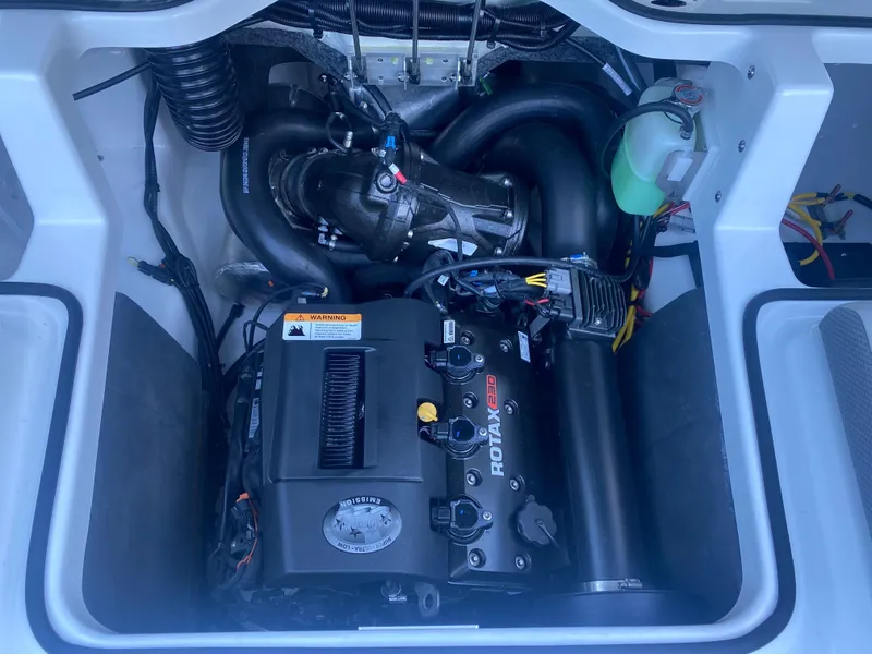 Slide: The Image of 2025 Scarab 195 SE engine compartment with Rotax motor, detailed view. - 14
