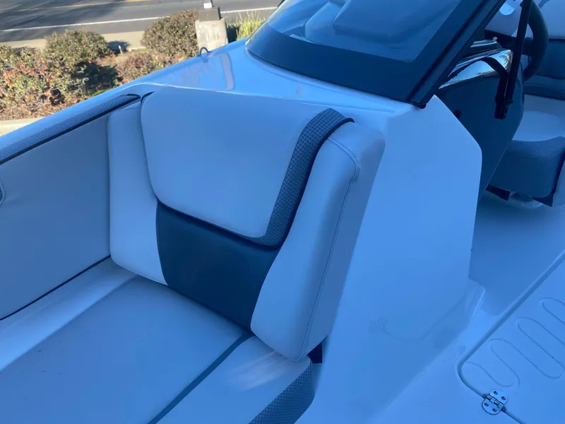 Slide: The Image of 2025 Scarab 195 SE boat interior with sleek white and gray seating. - 17