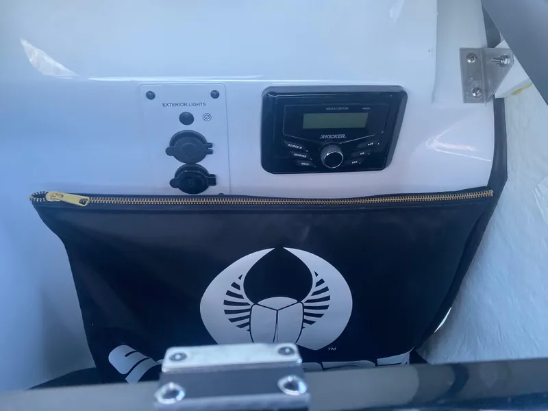Slide: The Image of Scarab 195 SE 2025 dashboard with audio system and storage compartment. - 20