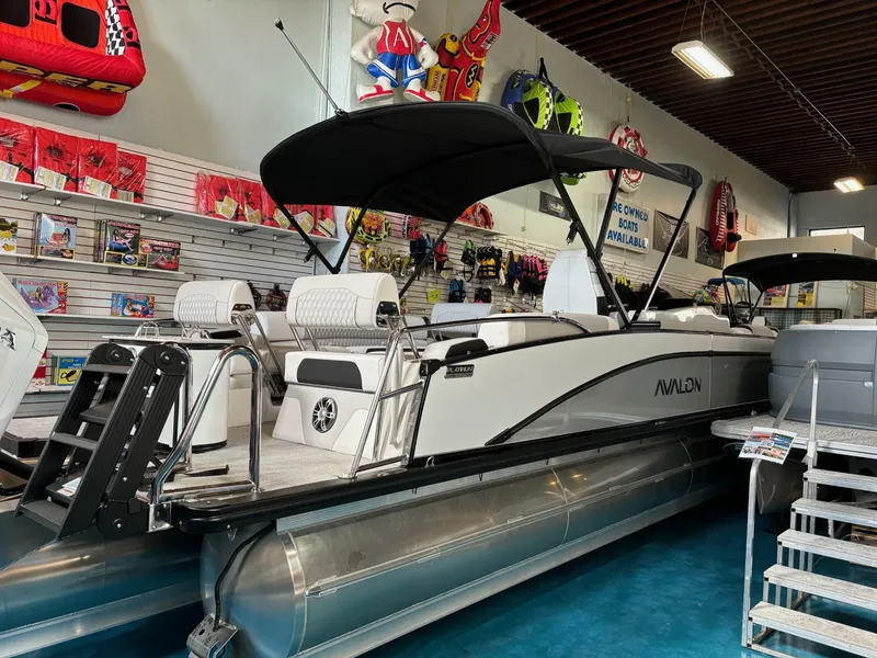 The Image of 2025 Avalon Catalina Quad Lounger Shift pontoon boat displayed in showroom. - 0