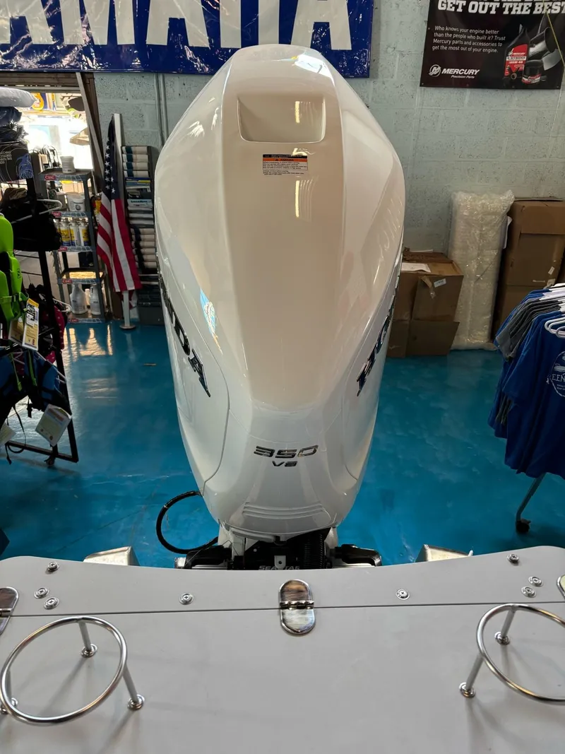 Slide: The Image of 2025 Avalon Catalina Quad Lounger Shift with powerful 350 engine in showroom. - 11