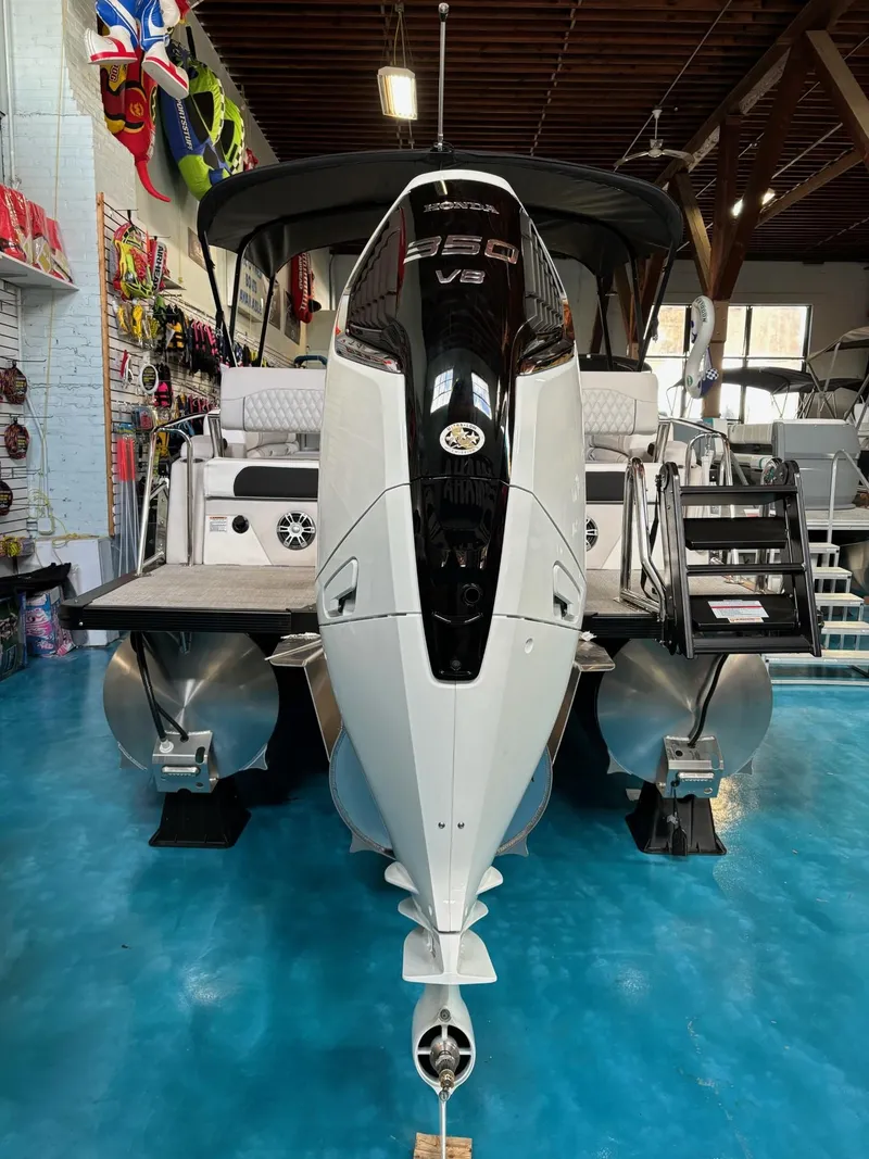 Slide: The Image of 2025 Avalon Catalina Quad Lounger Shift boat with powerful V6 engine in showroom. - 13