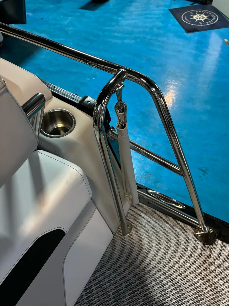 Slide: The Image of 2025 Avalon Catalina Quad Lounger Shift interior with stainless steel railing and cup holder. - 3