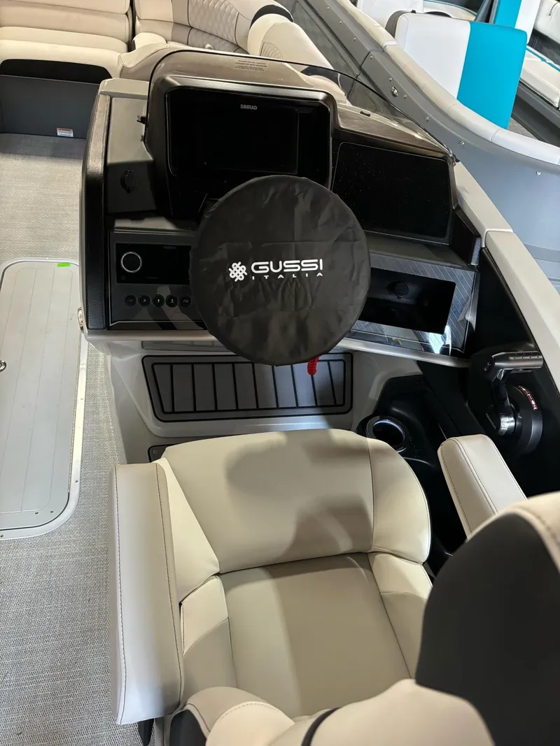 Slide: The Image of 2025 Avalon Catalina Quad Lounger Shift boat interior with Gussi steering wheel. - 7