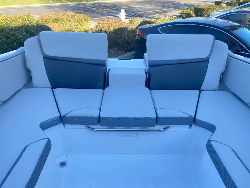 Slide: The Image of 2025 Scarab 215 SE boat interior with cushioned seating and sleek design. - 19