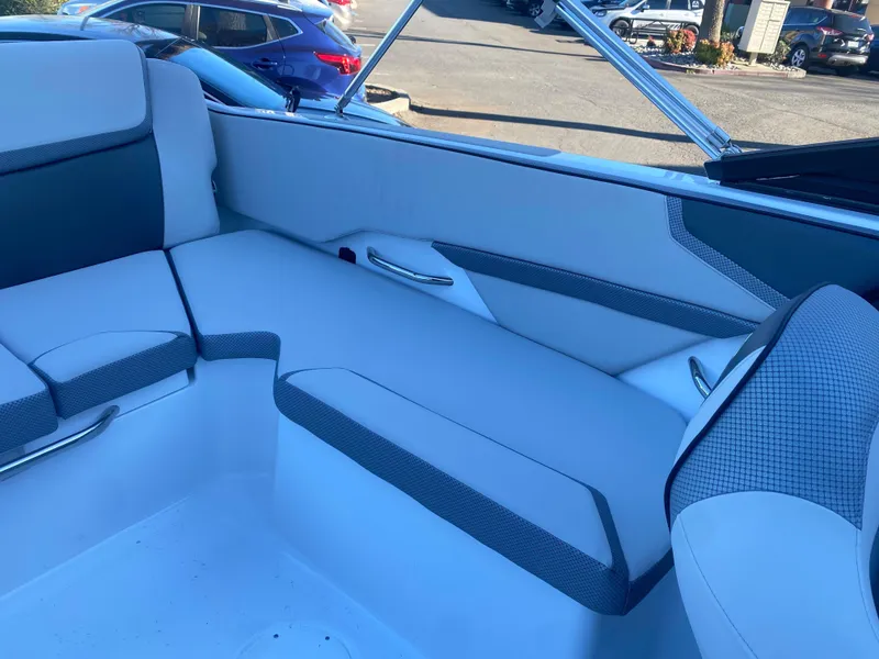 Slide: The Image of 2025 Scarab 215 SE boat interior with sleek white and gray seating. - 20