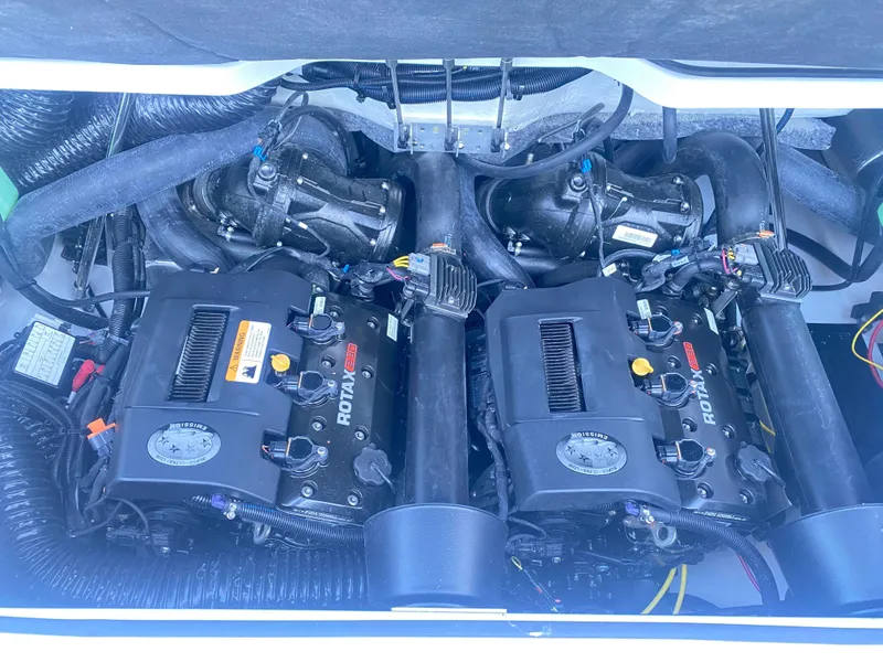 Slide: The Image of Dual Rotax engines in a 2025 Scarab 215 SE boat. - 22