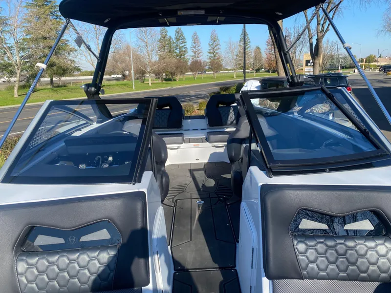 Slide: The Image of 2025 Scarab 235 LX Wake boat interior with modern seating and sleek design. - 10