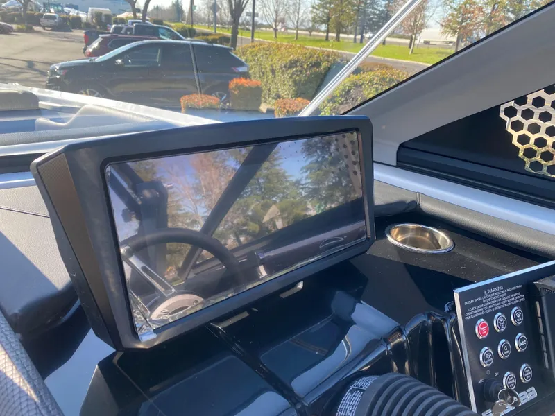 Slide: The Image of Dashboard of 2025 Scarab 235 LX Wake boat with touchscreen display. - 13