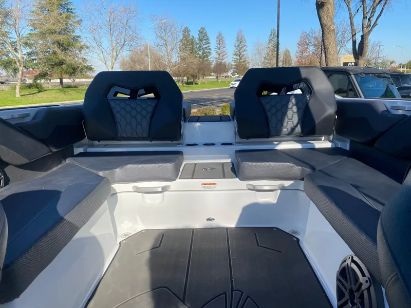 Slide: The Image of 2025 Scarab 235 LX Wake boat interior with modern seating and sleek design. - 17