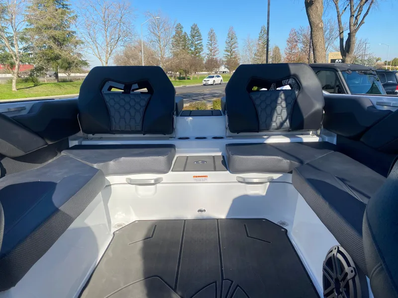 Slide: The Image of Interior of 2025 Scarab 235 LX Wake boat with seating and modern design. - 18