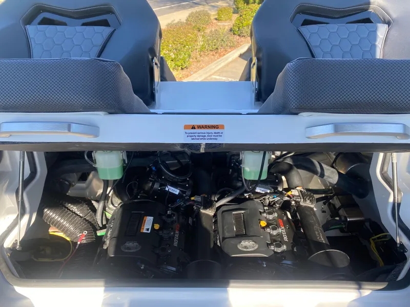 Slide: The Image of 2025 Scarab 235 LX Wake boat engine compartment with dual engines visible. - 21
