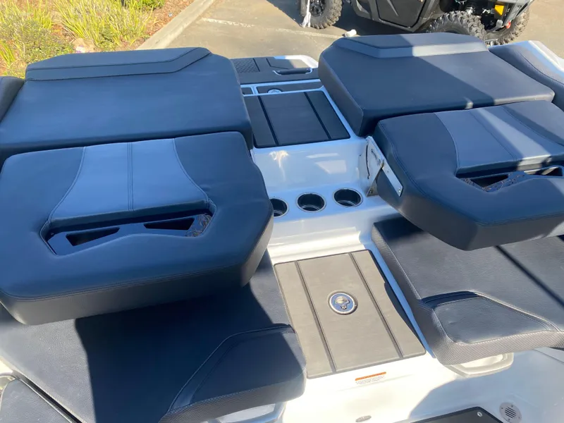 Slide: The Image of 2025 Scarab 235 LX Wake boat interior with cushioned seating and cup holders. - 23