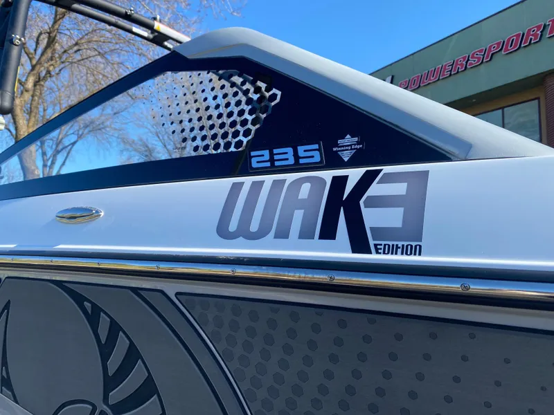 Slide: The Image of 2025 Scarab 235 LX Wake Edition boat, close-up of branding and design details. - 6
