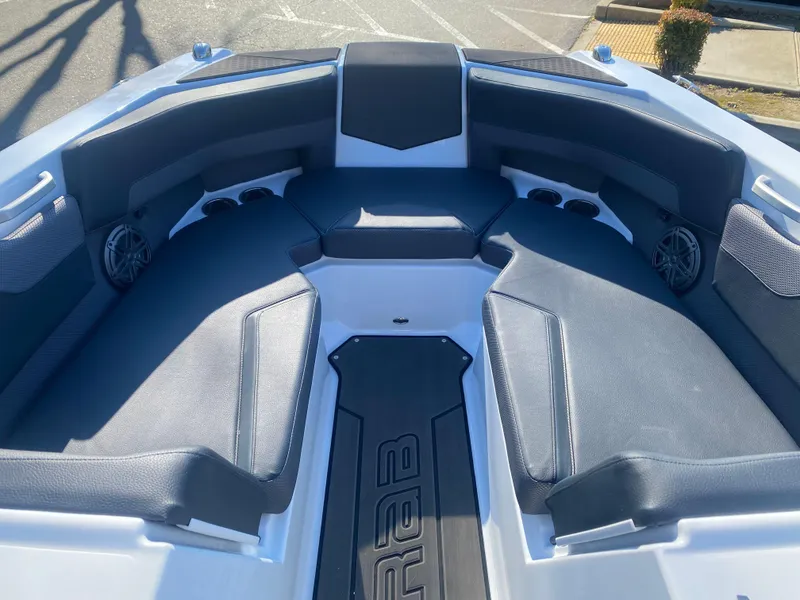 Slide: The Image of 2025 Scarab 235 LX Wake boat interior with sleek seating and modern design. - 7