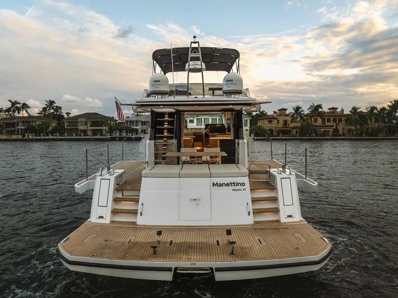 Slide: The Image of 2022 Pardo Yachts E60 on water, rear view at sunset. - 12