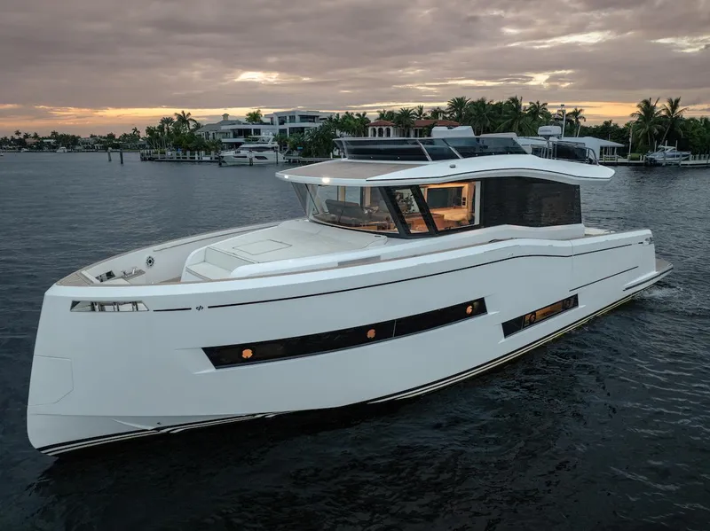 Slide: The Image of 2022 Pardo Yachts E60 cruising at sunset on calm waters. - 15