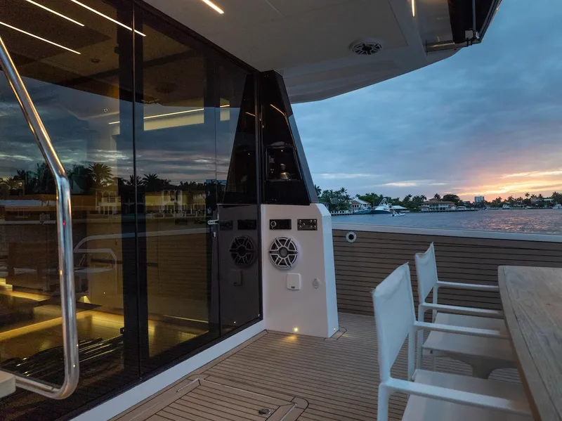 Slide: The Image of Luxurious 2022 Pardo Yachts E60 deck at sunset, featuring elegant seating and modern design. - 20