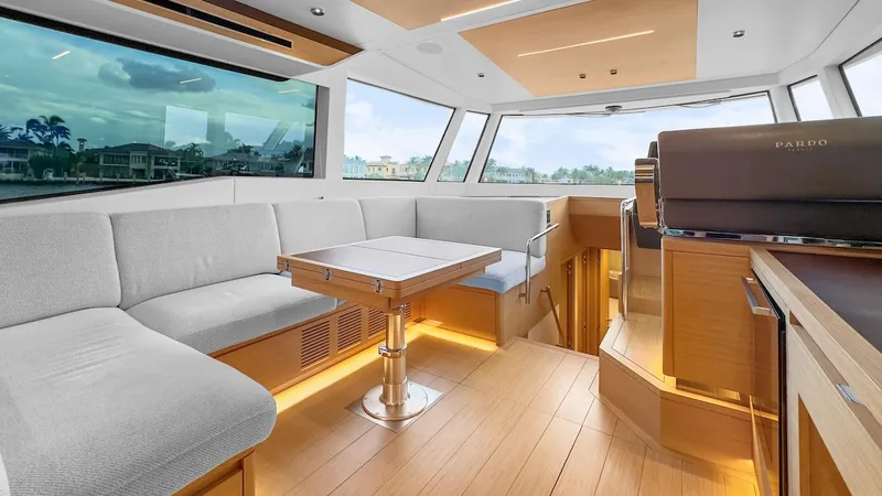 Slide: The Image of Luxurious interior of 2022 Pardo Yachts E60 with modern seating and panoramic windows. - 23