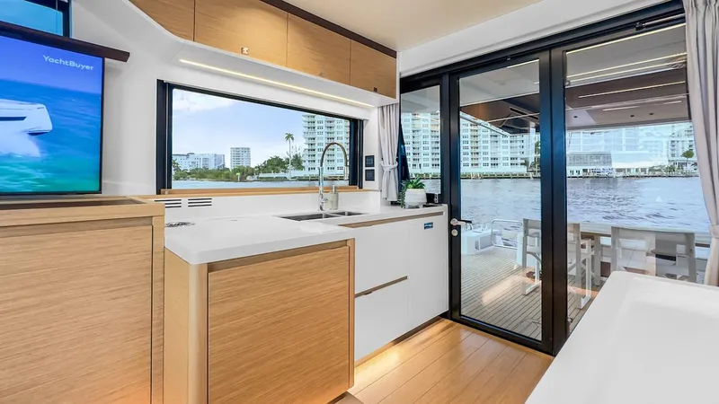 Slide: The Image of Modern kitchen interior of 2022 Pardo Yachts E60 with waterfront view. - 25