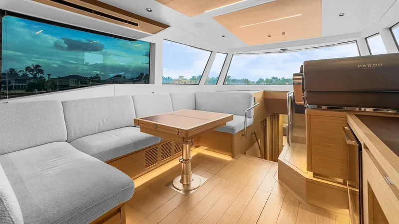 Slide: The Image of Luxurious interior of 2022 Pardo Yachts E60 with modern seating and panoramic windows. - 26