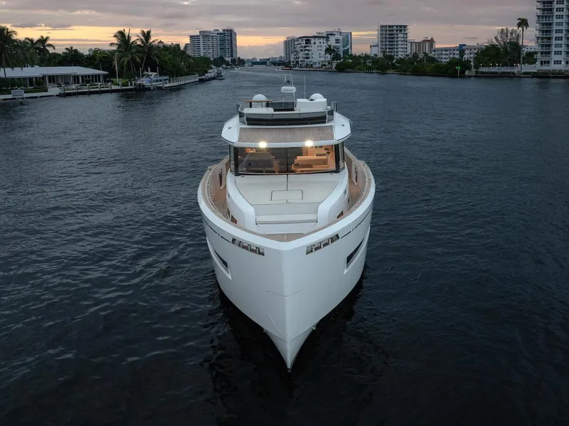 Slide: The Image of 2022 Pardo Yachts E60 cruising on a serene waterway at sunset. - 3