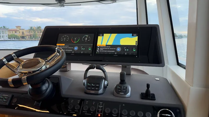 Slide: The Image of Interior helm of 2022 Pardo Yachts E60 with dual navigation screens and controls. - 34