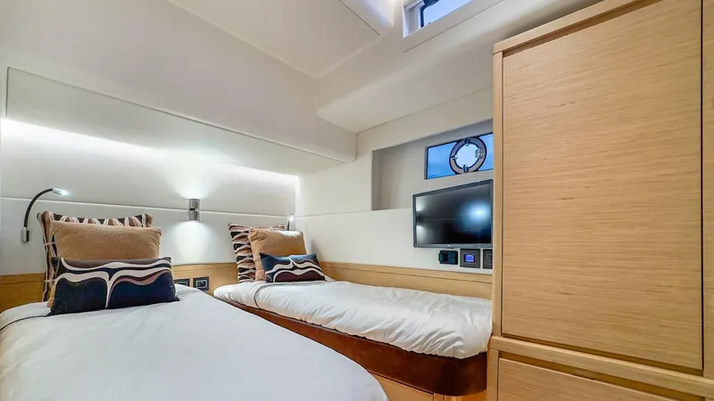 Slide: The Image of Luxurious twin cabin in 2022 Pardo Yachts E60, featuring modern design and cozy bedding. - 38