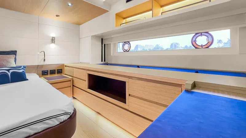 Slide: The Image of Luxurious interior of 2022 Pardo Yachts E60 with modern wood finishes and large window. - 46