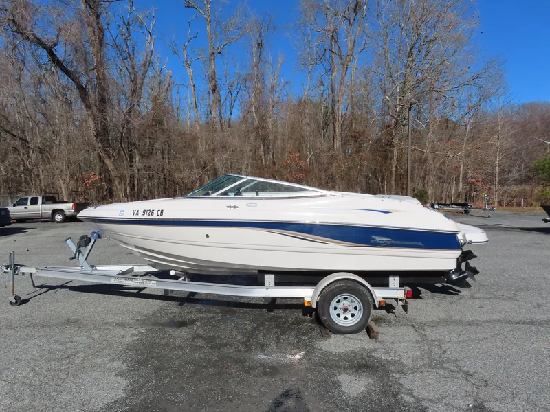 Slide: The Image of 2004 Chaparral 190 SSi boat on trailer in wooded area. - 1