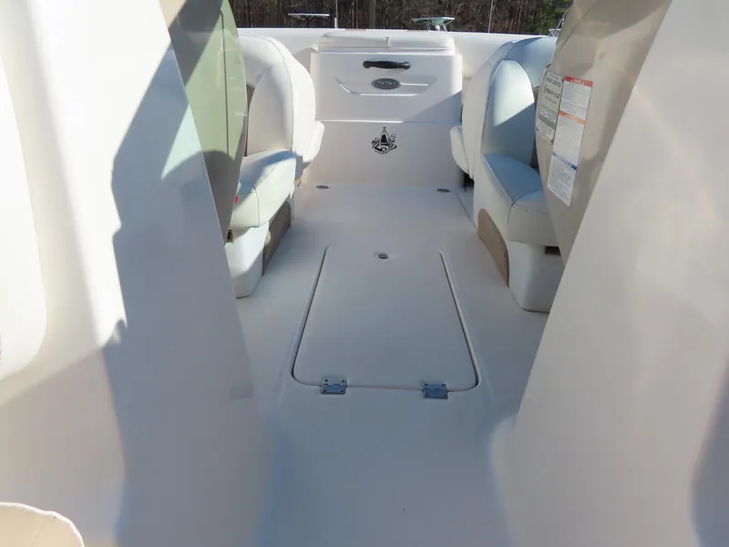 Slide: The Image of 2004 Chaparral 190 SSi boat interior with seating and storage compartments. - 10
