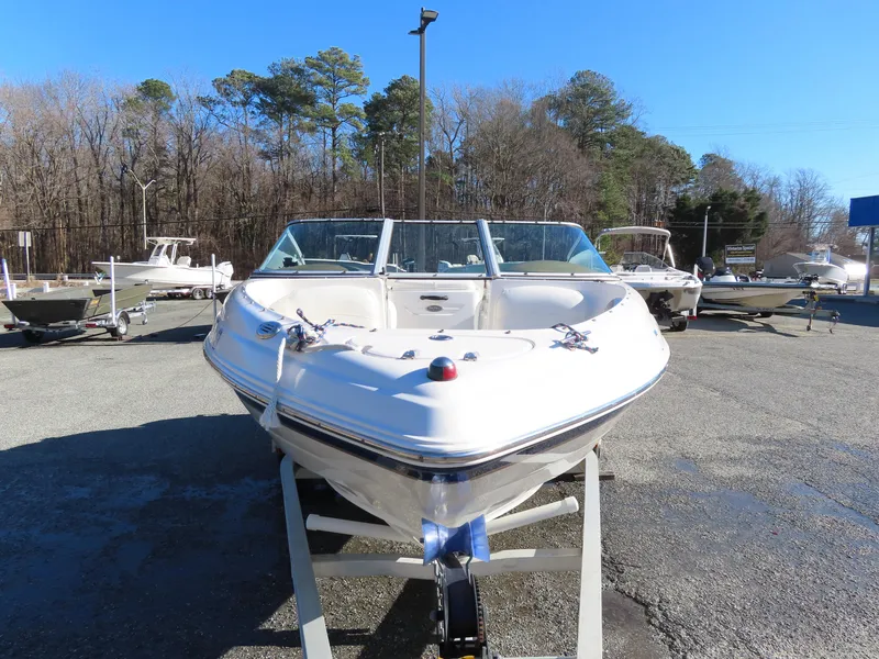 Slide: The Image of 2004 Chaparral 190 SSi boat on trailer, parked outdoors on a sunny day. - 12