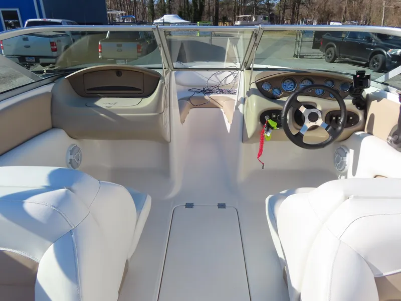 Slide: The Image of 2004 Chaparral 190 SSi boat interior with steering wheel and seating. - 13