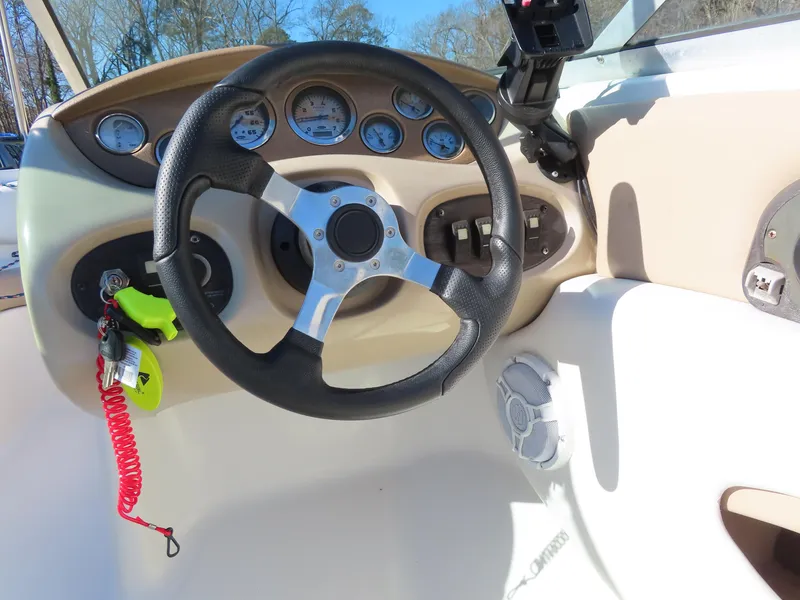 Slide: The Image of 2004 Chaparral 190 SSi boat dashboard with steering wheel and gauges. - 17