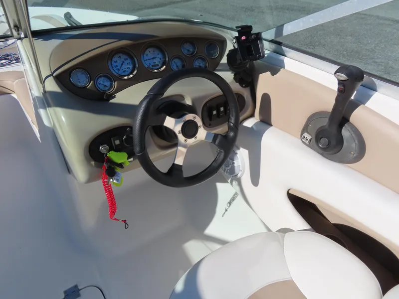 Slide: The Image of 2004 Chaparral 190 SSi boat dashboard with steering wheel and control panel. - 18