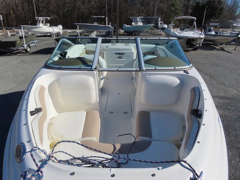 Slide: The Image of 2004 Chaparral 190 SSi boat with open bow seating, parked in a marina. - 9