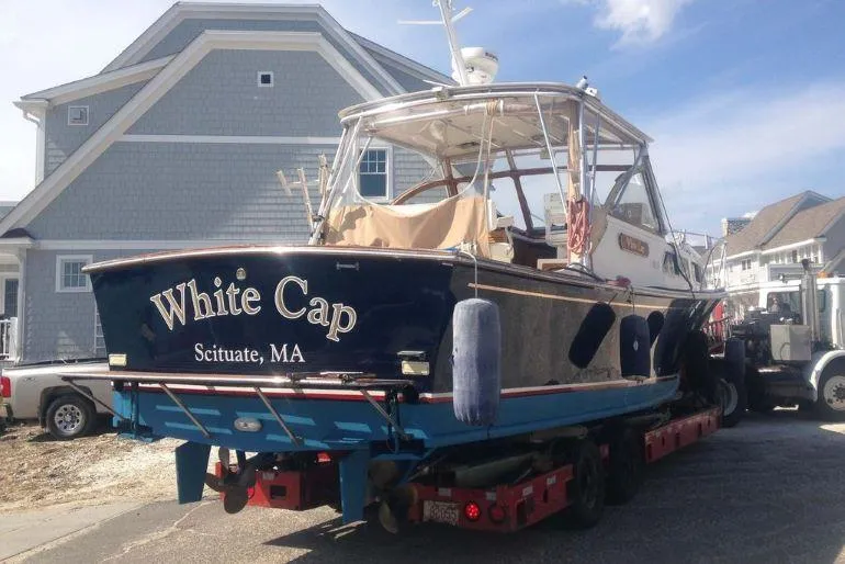 Slide: The Image of 1997 Fortier 33 HT Express boat "White Cap" on trailer in Scituate, MA. - 10