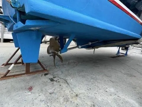 Slide: The Image of 1997 Fortier 33 HT Express boat hull and propeller on dry dock. - 13