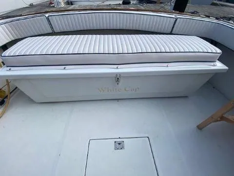 Slide: The Image of Fortier 33 HT Express 1997 boat with cushioned seating and storage. - 22