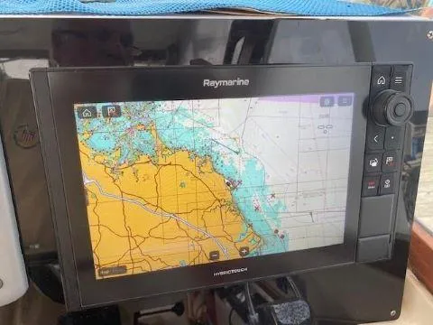 Slide: The Image of Raymarine navigation system on 1997 Fortier 33 HT Express boat, displaying nautical chart. - 29