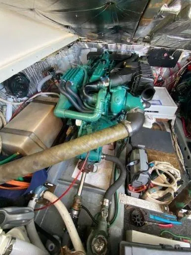 Slide: The Image of Engine room of 1997 Fortier 33 HT Express with visible components and wiring. - 30