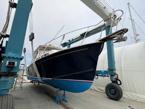 Slide: The Image of 1997 Fortier 33 HT Express boat in dry dock, undergoing maintenance. - 9