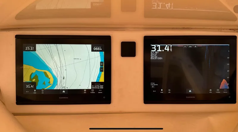 Slide: The Image of Navigation screens on a 1996 Luhrs Tournament 320 Open boat dashboard. - 10
