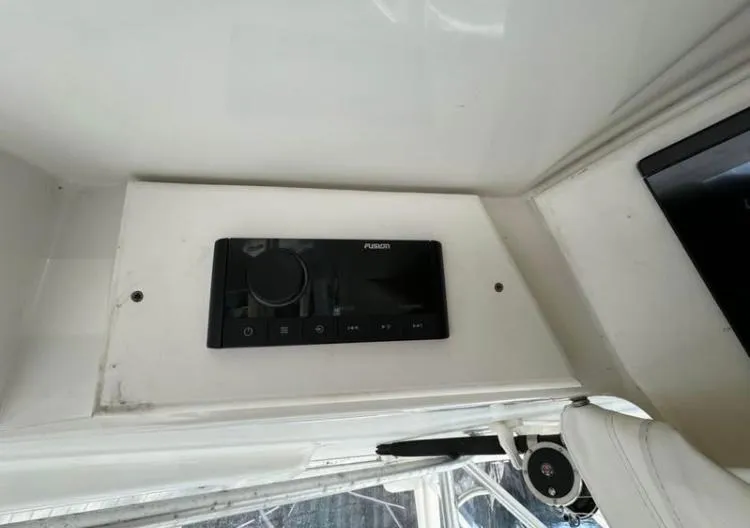 Slide: The Image of 1996 Luhrs Tournament 320 Open boat interior with Fusion stereo system. - 6