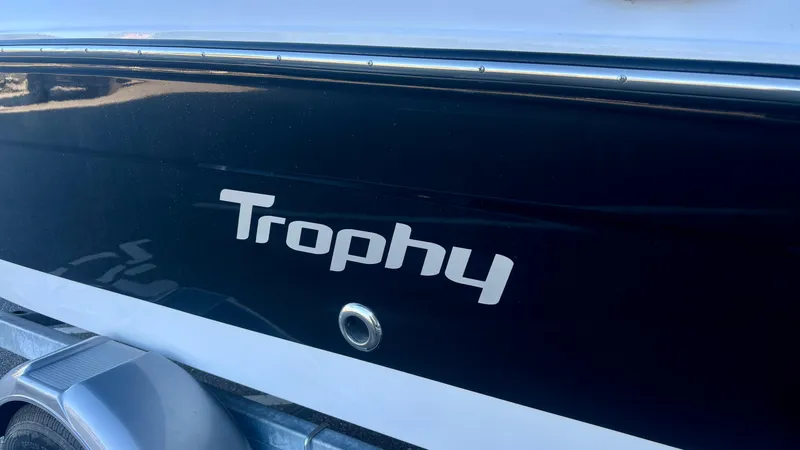 Slide: The Image of 2025 Bayliner T18 Limited Edition boat with "Trophy" logo on the side. - 2